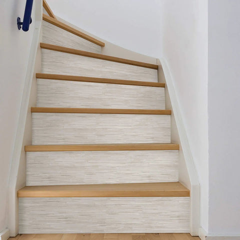 Cream Vinyl Grassweave Peel And Stick Wallpaper for Easy DIY Accent Walls, applied on stairs, repositionable and no mess.