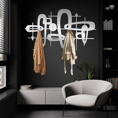 Slick Mid Century Metal Coat Rack With Abstract Wall Hooks, featuring two hanging jackets in a modern entryway setting.