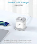 7 In 1 Power Strip Cube With 4 Outlets And 3 USB Ports on a table, showing charging features with devices connected, 5 foot cord.