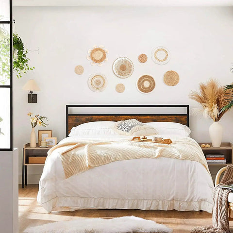 Bedroom with Nine Piece Boho Wall Basket Set Made From Seagrass And Rattan Round Handmade Hanging Baskets above bed.