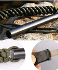 Survival Fire Starter Kit With Drilled Ferrocerium Rod Half Inch By Six Inch Striker Pro Striker Paracord Lanyard And Large Handle Built For Easy Spark Strikes Camping Gear For Camping Trips Emergency Prep And Outdoor Adventures showing ferro rod, paracord, and striker.