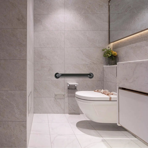 Built Different 24 Inch Matte Black Bathroom Grab Bars Two Pack Wall Mounted Safety Handles near toilet in modern bathroom.