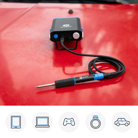 FixHub Portable Soldering Station With Quick Heat Up And Two Smart Ports for electronics on red car hood