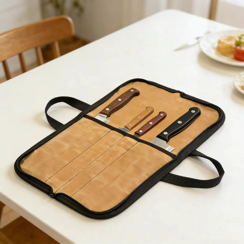 Durable Portable Chefs Knife Roll With 4 Slots Grab And Go Water Repellent Canvas Knife Storage Bag open on table with knives