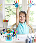 Child raising hands near 360 Degree Rotating Desk Organizer with 9 Deep Bins on a desk with art supplies in a bright room.
