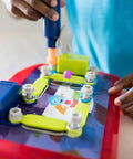 Child using a kid-friendly drill on Space Circuits Beginner Circuit Building Kit For Kids 52 Piece STEM Toy for hands-on learning.