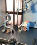 Stop Motion Armature Stand With Flexible Multi Joint Arm Height Adjustable Metal Bracket For Smooth Shots And Precise Angles Vertical Rack Design To Dial In Any Studio Setup Easily, metal arm angled over tabletop set