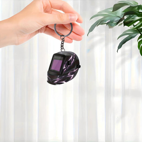Hand holding Lightning Pattern Welding Helmet Keychain With Durable Chain And Key Ring For Keys, Bags, And Cars, Lightweight Acrylic Accessory