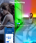 Woman in bed with 32.8 Ft Smart RGB LED Strip Lights For Bedroom With App Control showing timing settings and color change