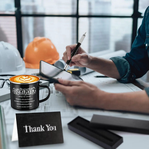 Engineer Gift Set For Men Includes 12 Oz Enamel Mug, socks, ballpoint pen, gift box and thank-you card in an office setting