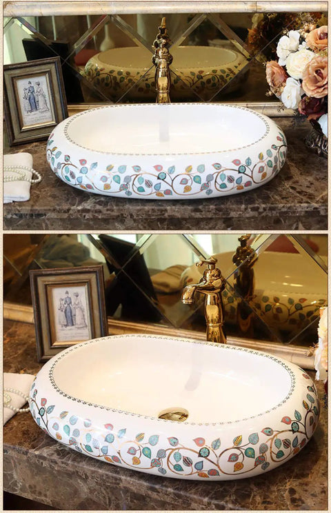 Damn Fine Hand Painted Oval Countertop Washbasin With A Truly Knockout Leaf Pattern Heavy Duty Ceramic Bathroom Sink on marble countertop.