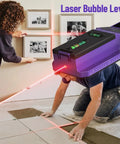 Person using SUNMAY Professional Stud Finder with 7-in-1 Wall Scanner & Laser Level for picture framing and tile alignment.