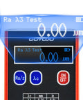 Close-up of Surface Roughness Tester With 0.01μm Precision showing digital display for Ra Rq Rz Rt readings, battery indicator visible.