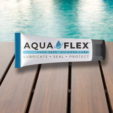 Tube of Premium Silicone Lubricant Grease NSF H1 Food Grade Registered Go To All Purpose Lube on wooden deck near water