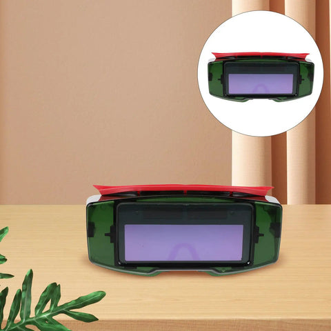 Top Shelf Auto Darkening Welding Goggles With Rugged Impact Resistant Lens For Hardcore Industrial And Garage Work front view on wooden surface.