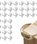 36 Pack Clear Corner Protectors For Baby Rock Solid Table Edge Guards For Furniture Foolproof Child Proofing Bumpers installed on table edge.