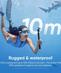 Woman underwater holding Tiny 4K Vlogging Cam With 128 GB White, Hands Free POV, demonstrating 10m waterproof feature.