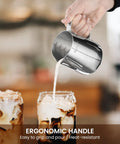 Barista Grade 12oz 350ml Milk Frother Cup With Scale In 304 Stainless Steel being used to pour milk into coffee