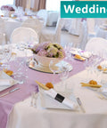 Elegant table setting with Self Adhesive Napkin Bands One Point Five By Four Point Twenty Five Inches Black at a wedding event.