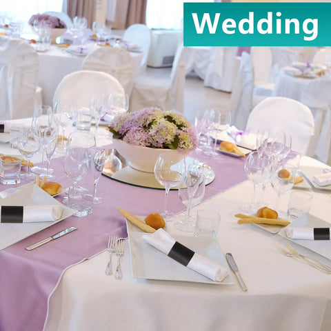 Elegant table setting with Self Adhesive Napkin Bands One Point Five By Four Point Twenty Five Inches Black at a wedding event.