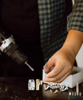 Pro Grade Quick Change Drill Chuck Reducer Adapter for Cordless Rotary Tools with copper and stainless steel collet in use.
