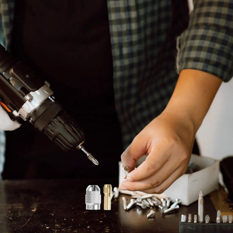 Pro Grade Quick Change Drill Chuck Reducer Adapter for Cordless Rotary Tools with copper and stainless steel collet in use.