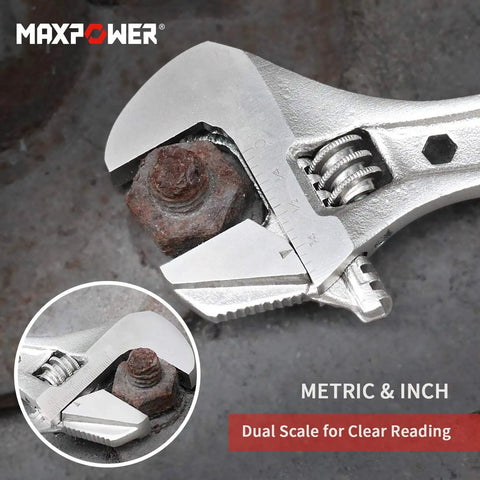 4 Piece Adjustable Wrench Set With Reversible Jaw And Box End Hex Function grips rusty bolt on metal surface.