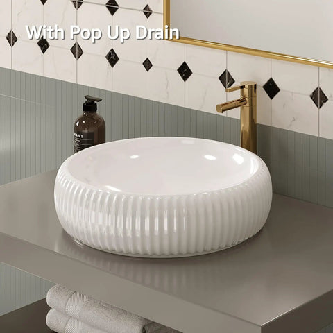 Fluted white round vessel sink for bathroom vanity, with pop up drain, modern design on grey countertop.