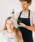 Person using 18 Piece At Home Hair Dye Kit With Bowl Brush Agitator Dye Comb Clips Caps Gloves Earmuffs And Storage Bag