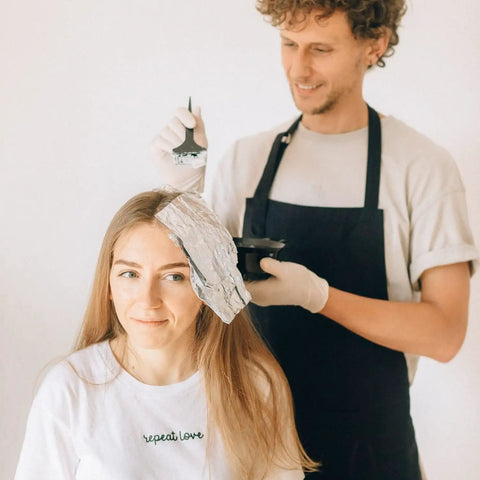 Person using 18 Piece At Home Hair Dye Kit With Bowl Brush Agitator Dye Comb Clips Caps Gloves Earmuffs And Storage Bag