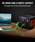 Solar Generator 1000 V2 Portable Power Station with laptop and phone connected via USB-C.