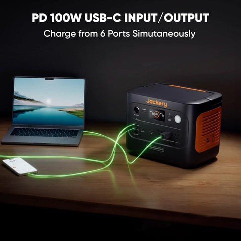 Solar Generator 1000 V2 Portable Power Station with laptop and phone connected via USB-C.