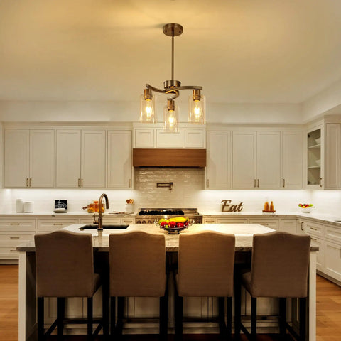 Three Light Brushed Nickel Pendant Chandelier For Kitchen Island, Modern Industrial Hanging Lamp With Clear Glass Shade above kitchen island.