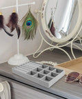 Slick Velvet Jewelry Tray With Anti Scratch Compartments For Rings And Bracelets Includes Dual Grid Foam Inserts on vanity.