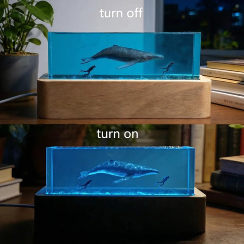 Ocean Scene Resin Night Light With Wood Base Usb Powered Lamp For Bedroom Decor Dope Blue Ambient Glow Sea Themed Gift For Scuba Divers And Marine Biology Fans Featuring A Humpback Whale Figurine turned on and off on a desk