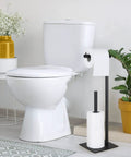 Freestanding Toilet Paper Holder Stand With Storage For Bathroom Black Iron Dispenser beside white toilet, minimal design.