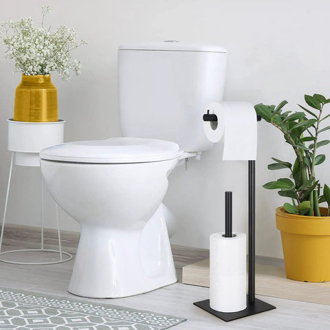Freestanding Toilet Paper Holder Stand With Storage For Bathroom Black Iron Dispenser beside white toilet, minimal design.