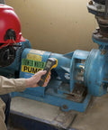 Worker inspecting Tower Water Pump with Rock Solid LED Stroboscope Featuring 30 To 300000 FPM Flash Rate And Knockout Brightness.
