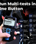 Hand using 12V Car Battery Tester With 100 To 2000 CCA Load Test Digital Auto Battery Analyzer Alternator Checker for diagnostics.