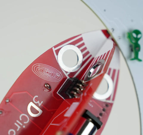 Spaceship Kit STEM Project Learn How To Solder Beginner Friendly Electronics Set With Tools Included For Teens 12 Plus And Adults To Build Real Circuits And Show Off Your Soldering Skills, red spaceship PCB close-up