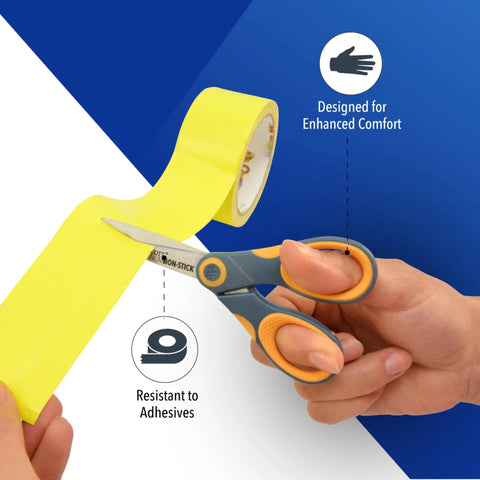5-Inch Non-Stick Titanium Scissors With Glide Adjust Technology cutting yellow tape, gray and yellow handles visible.