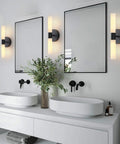Set Of Two Matte Black Wall Sconces With White Glass Shades For A Modern Bathroom And Living Room, Durable Metal Fixtures.