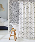Removable Peel And Stick Wallpaper With Modern Hand Drawn Spot Pattern in bedroom behind bathtub and shower curtain, 20.5 in x 16.5 ft