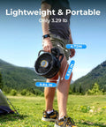 Person holding Rechargeable 20000mAh Portable Fan With 4 Speed Settings 9 Inch Blade, lightweight for camping outdoors.