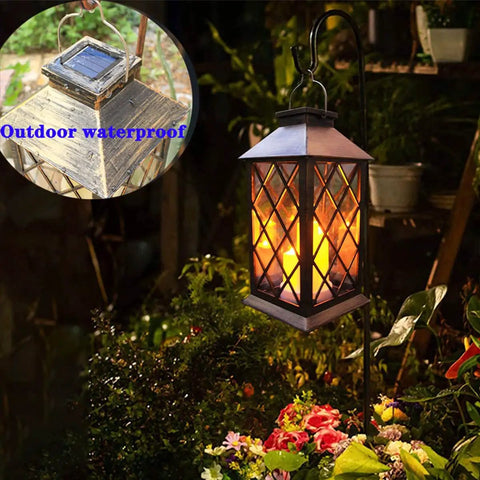 Outdoor Solar Lanterns Hanging Lantern PVC Waterproof 3 LED Flickering Flameless Candles For Patio Garden Table Decor Party 1 Pack With Easy S Hook Upgrade For Lit Night Ambiance on garden hook glowing at night by flowers.