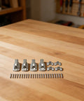 Set Of Four Spring Loaded Latches For Closets Cupboards And Cabinets In Stainless Steel With Easy Push To Open Design on table