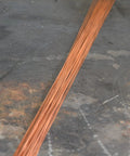 1/16 Inch ER70S-6 Mild Steel TIG Filler Rods on a workbench, 1 Lb Pack For Welding Mild Steel, Built Tough And Smooth Flow.
