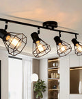 4 Light Track Lighting Fixture In Black Industrial Style With Open Wire Cage, installed in modern living room, E26 Base, bulbs not included