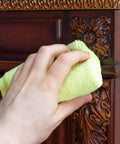 Hand polishing antique wood with cloth using All Natural Wood Cleaner And Polish For Furniture Care Replenishes And Restores Antique Wood