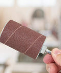 Garage Grade Drill Press Sanding Drum Kit includes a close-up of a sanding drum with quarter inch shank for woodworking tasks.